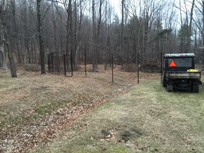 Yard with golf cart alongside it